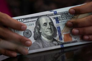 Dollar slides with investor confidence shaken in safety of US assets